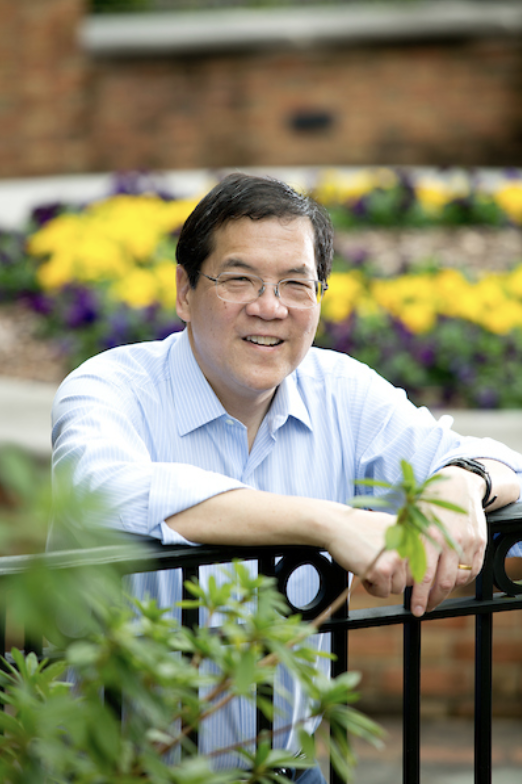 Photo of Dr. Stephen Chew with flowers in the background.